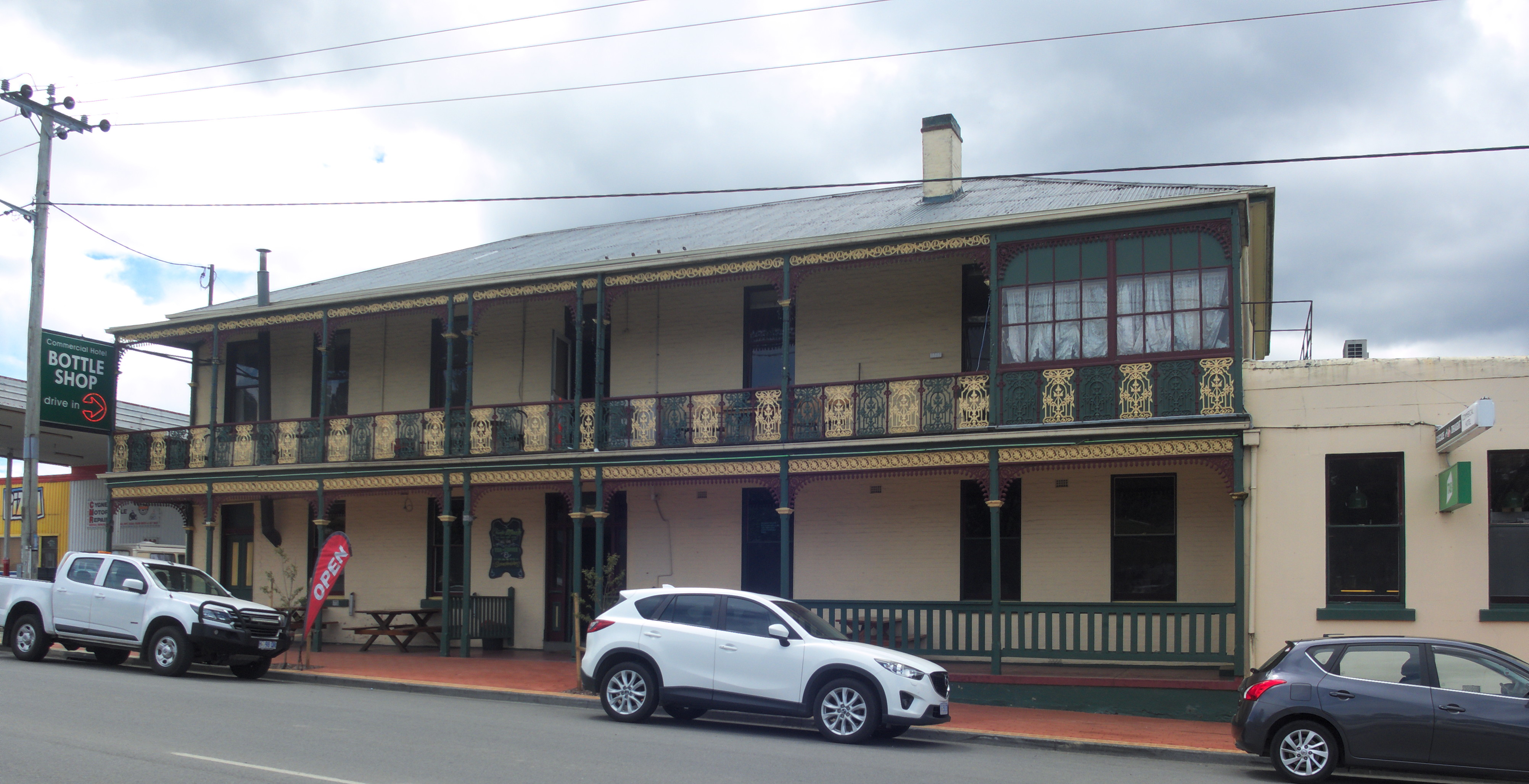 Commercial Hotel, Cygnet, Tasmania — the building’s long verandah, cast-iron lacework, and upper-storey balcony, photographed in 2020.